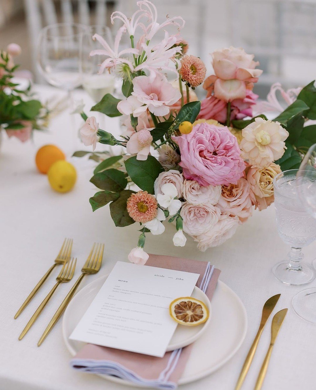 Flowers with a side of fruit might be my new favorite spring/summertime look.  N+J incorporated vibrant shades of pink, blush, yellow, coral and orange into their entire wedding design to create an Italian summer inspired garden party. ⁠
⁠
Venue @the