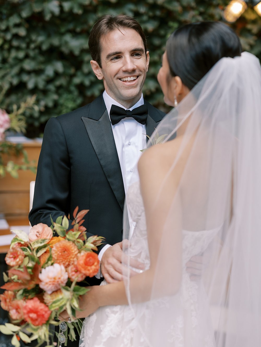 groom grins at bride during first look at the Wythe Hotel in Brooklyn NY