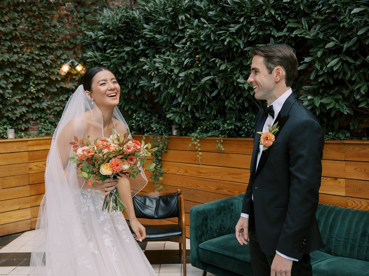 bride and groom have first look on patio at the Wythe Hotel