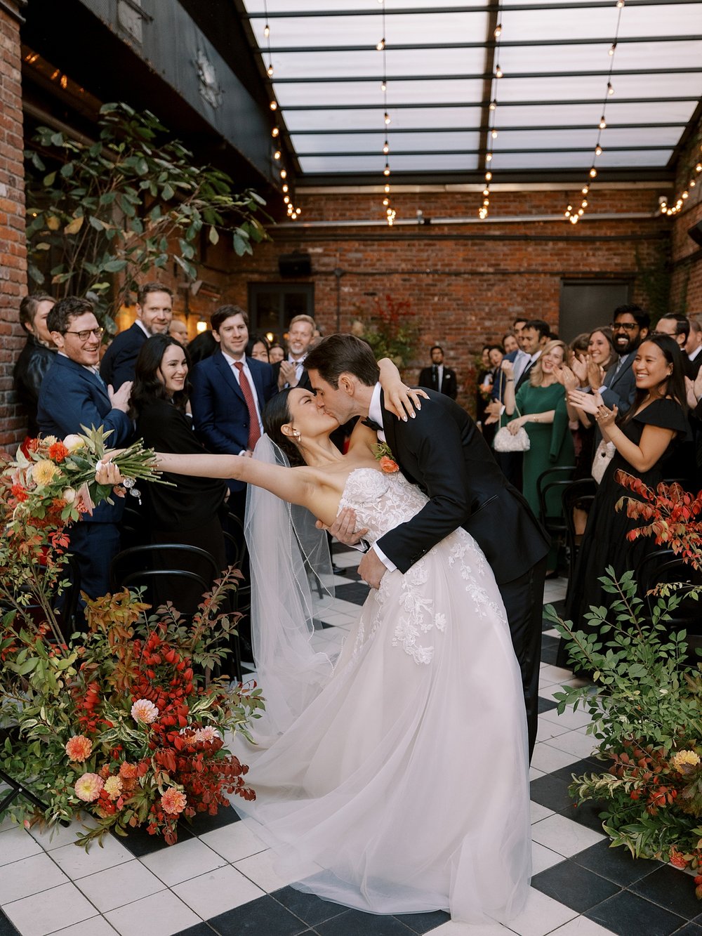 newlyweds kiss after ceremony at the Wythe Hotel