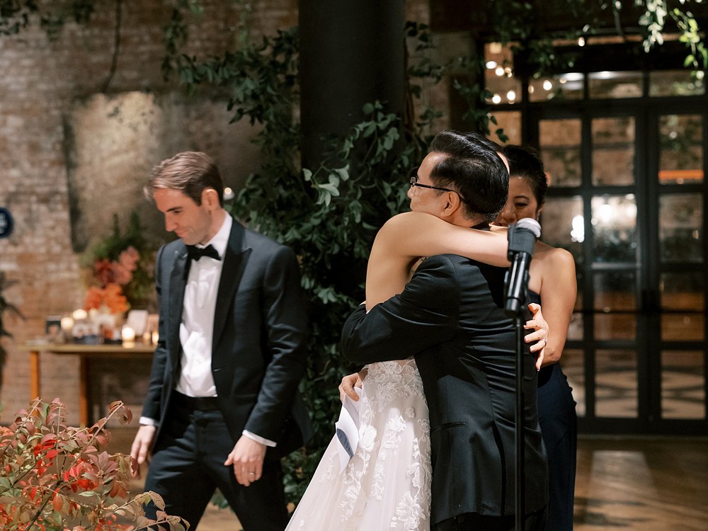 bride hugs father during Brooklyn NY wedding reception