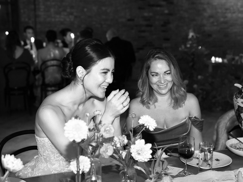 bride laughs with guests during Brooklyn NY wedding reception