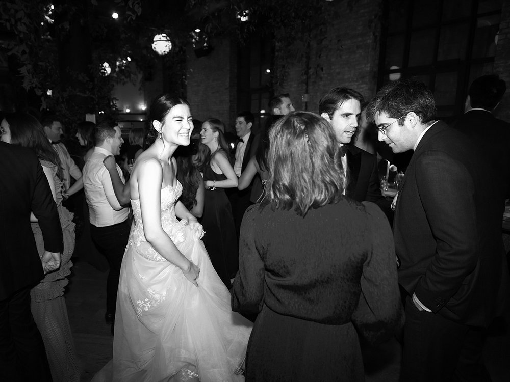 bride and groom dance with guests during Brooklyn NY wedding reception