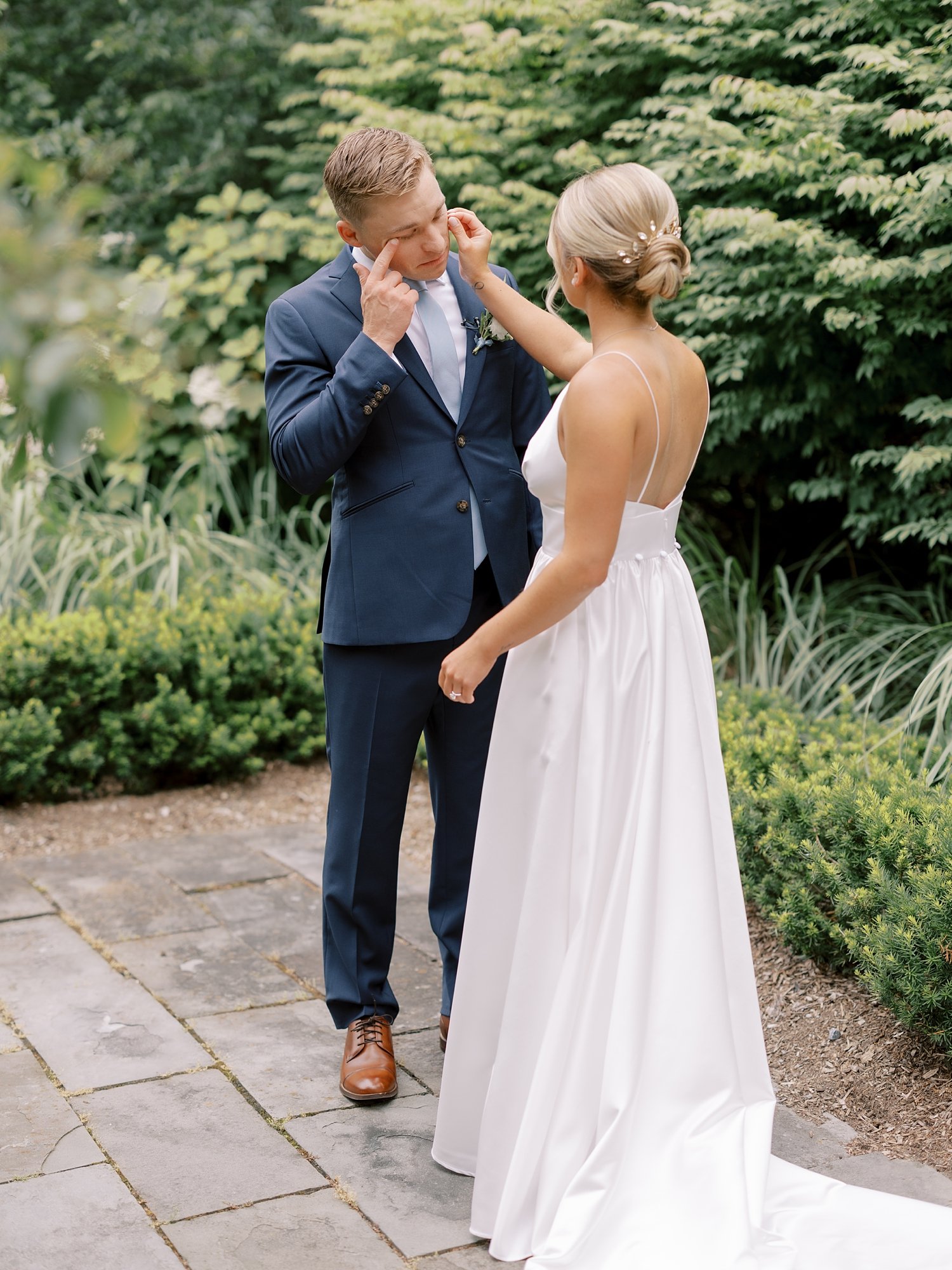 bride wipes away groom's tears during first look in Milton NY