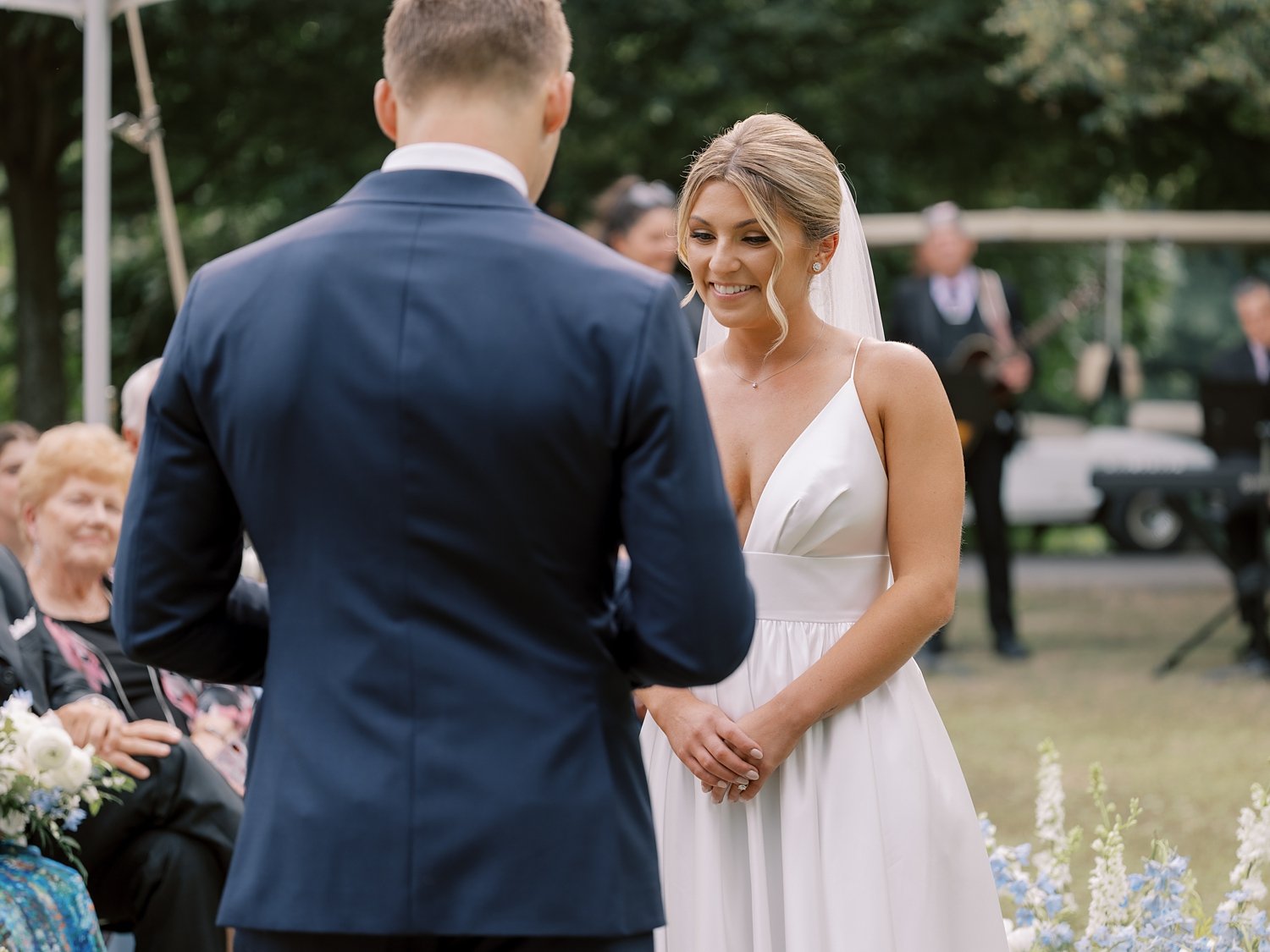 bride and groom hold hands at the Buttermilk Inn &amp; Spa in the ceremony 