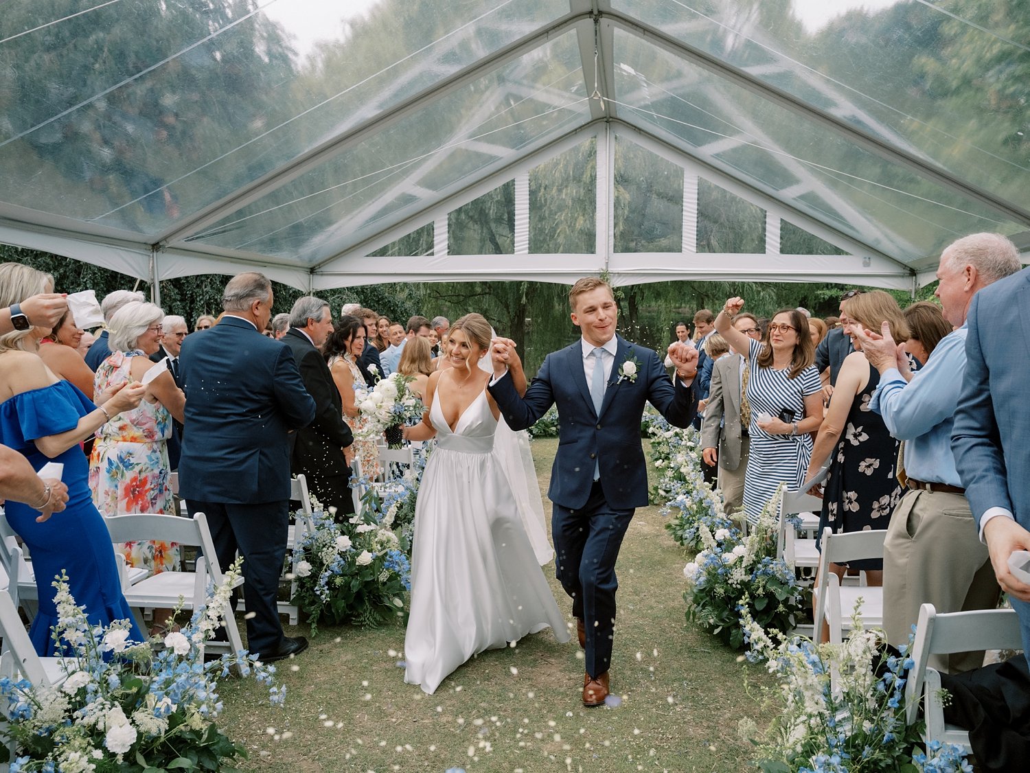 newlyweds walk up aisle at the Buttermilk Inn &amp; Spa