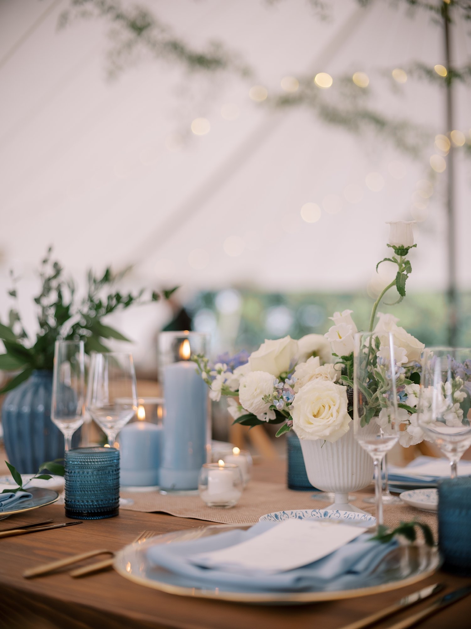 place setting with gold rimmed plate and blue menu card at the Buttermilk Inn &amp; Spa