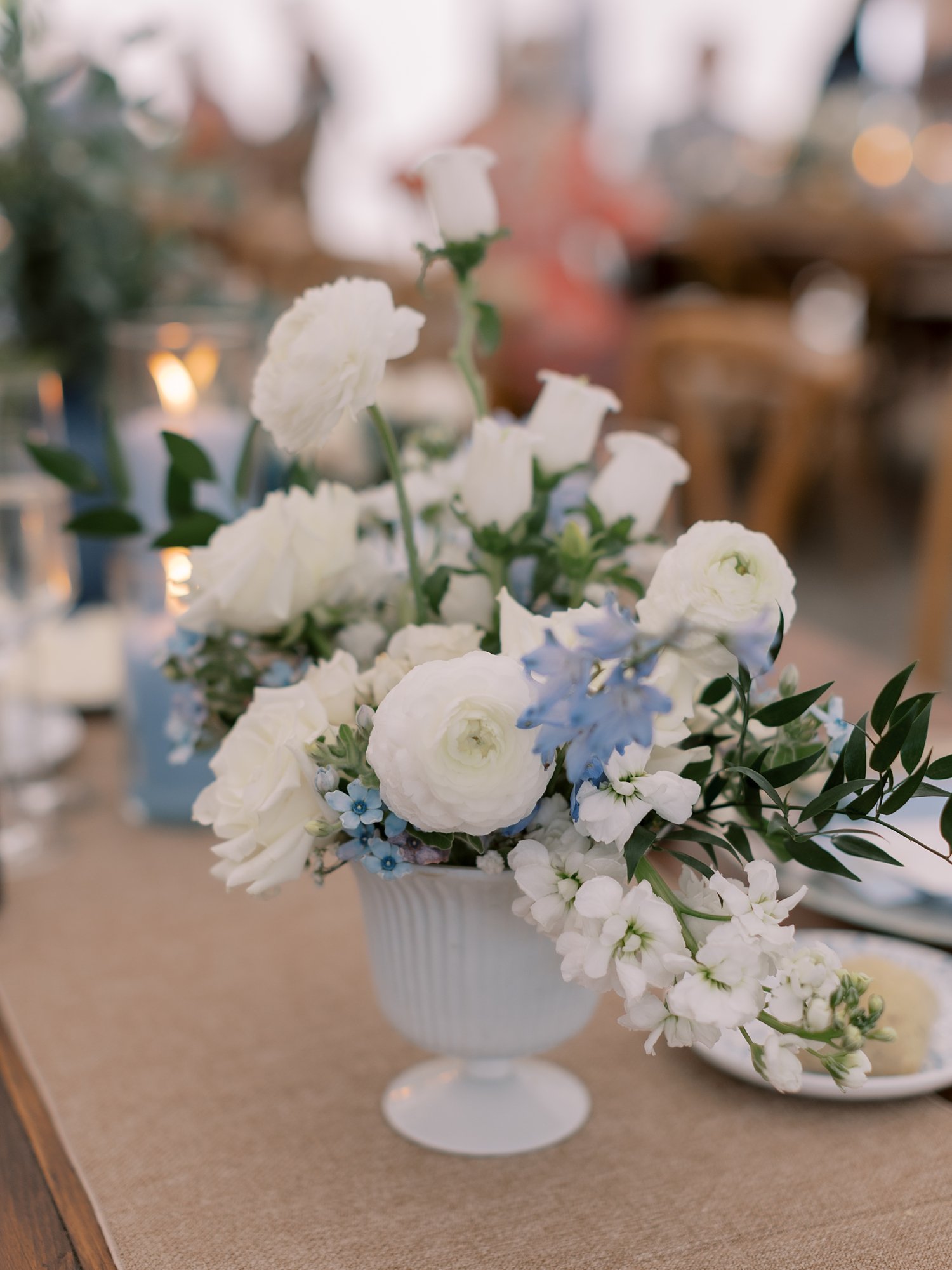 white and blue floral centerpieces at the Buttermilk Inn &amp; Spa