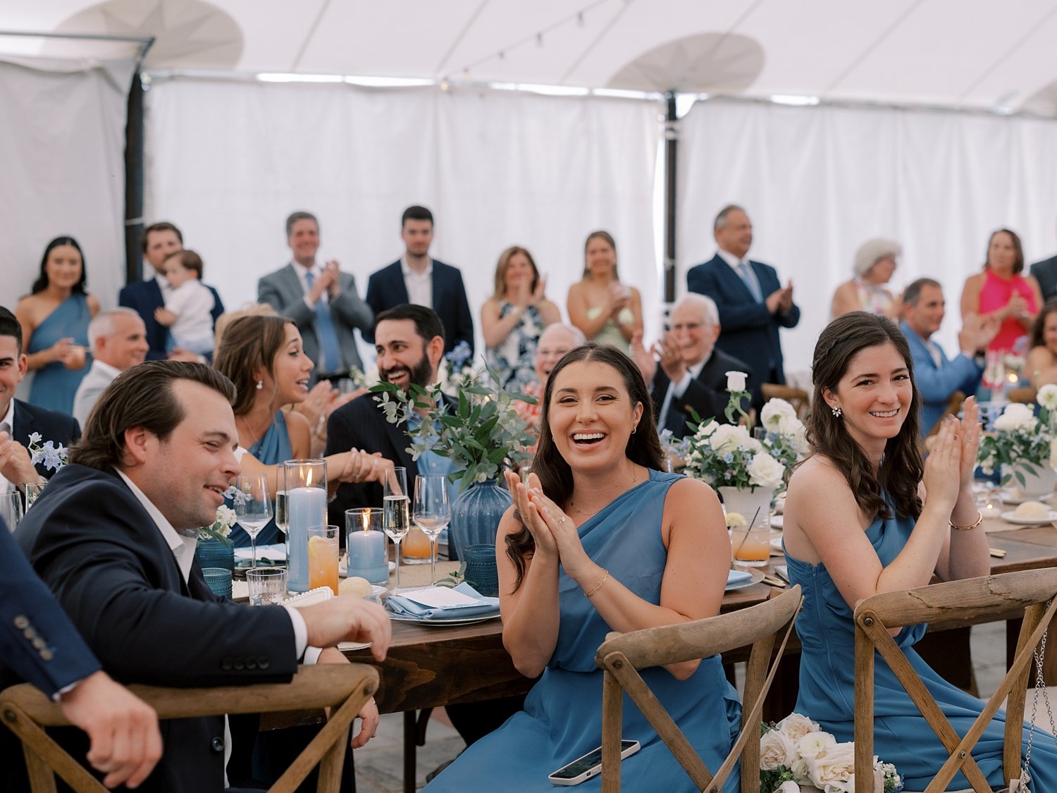 bridesmaid claps during toasts at the Buttermilk Inn &amp; Spa