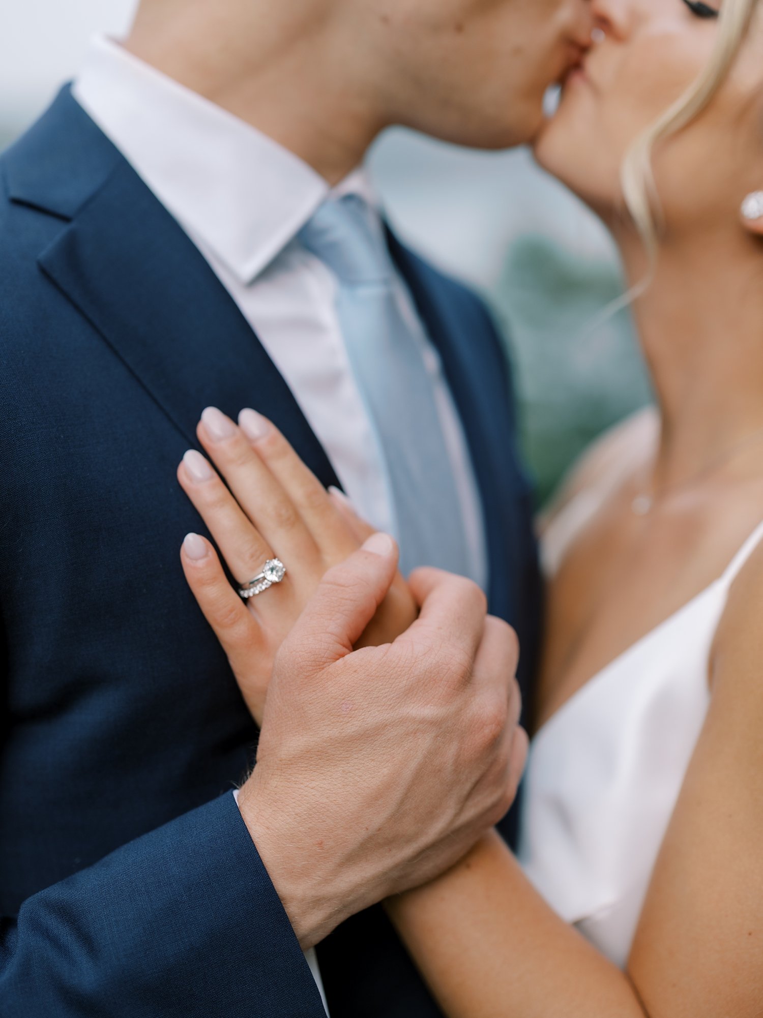 bride lays hand on groom's chest at the Buttermilk Inn &amp; Spa