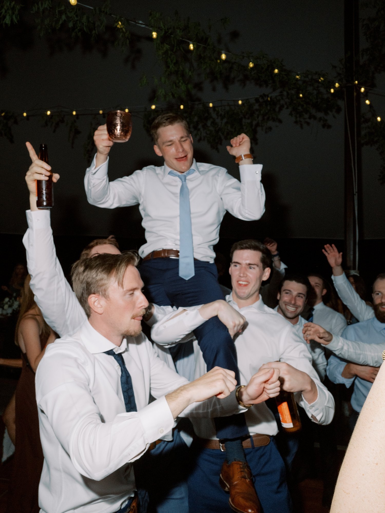 groom dances with groomsmen during Milton NY reception 