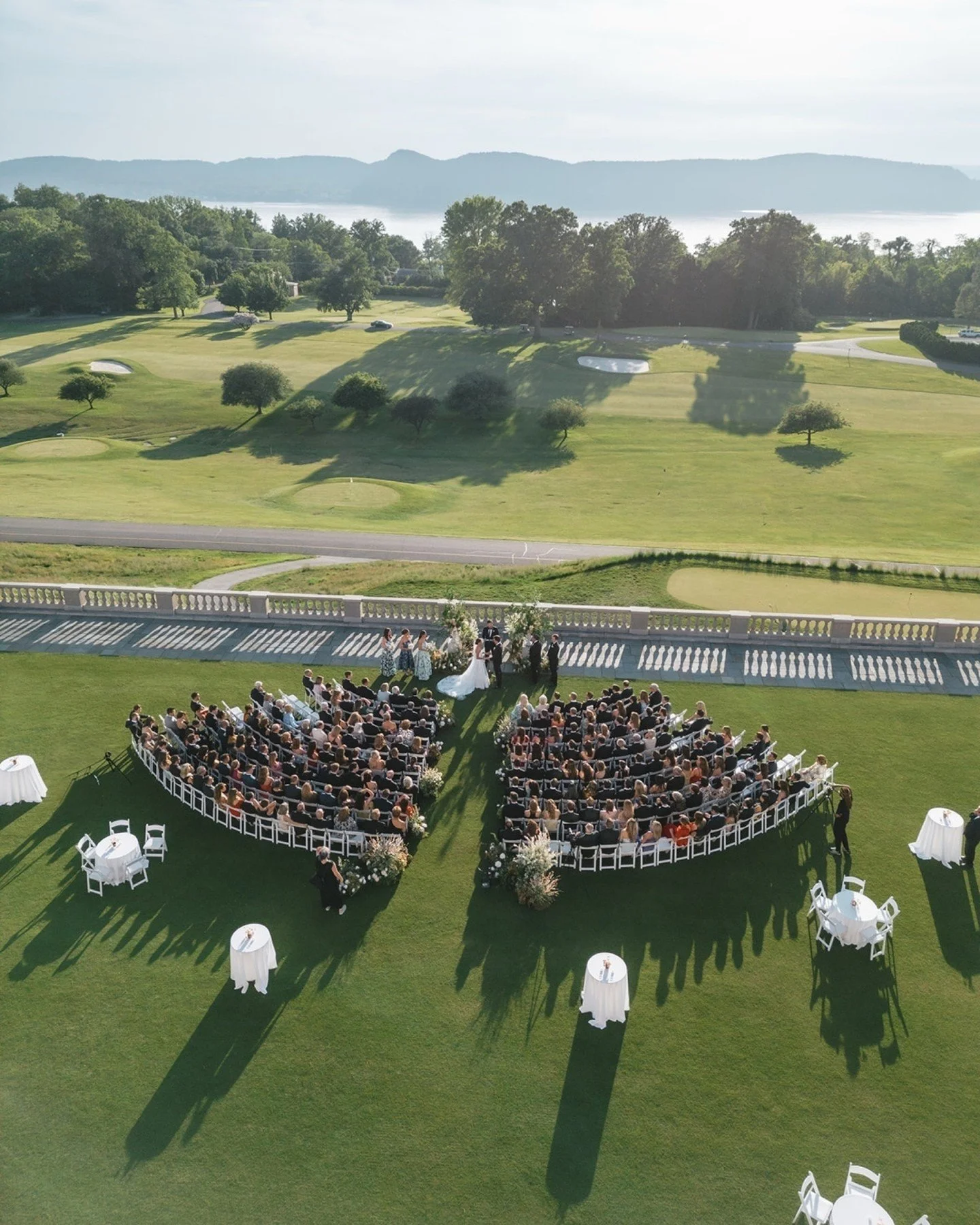 Drone view of a truly unforgettable day at Sleepy Hollow Country Club! From the lively ceremony with stunning views to the cocktail hour full of laughter and fun, every moment was full of joy. Candlelit rotunda shots, sunset portraits, and dancing in
