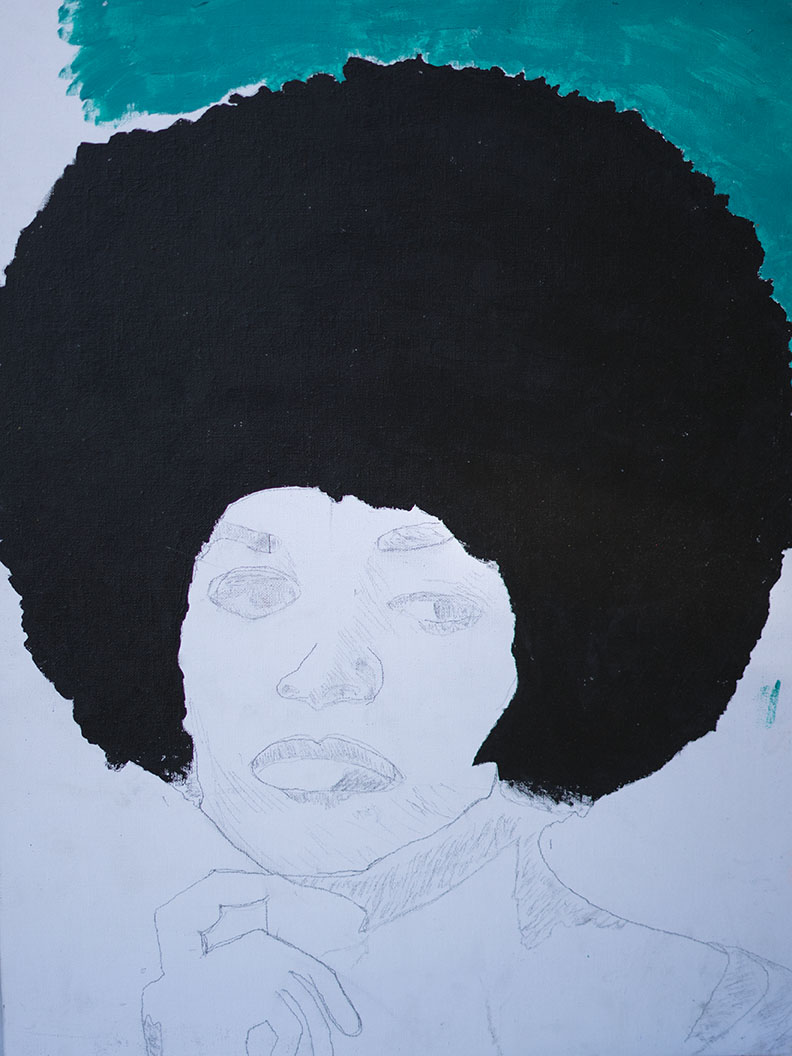 Partially completed art piece featuring a portrait of a woman with an afro hairstyle, with the hair painted in black and the face outlined in pencil. The woman appears to be holding her chin with her hand.