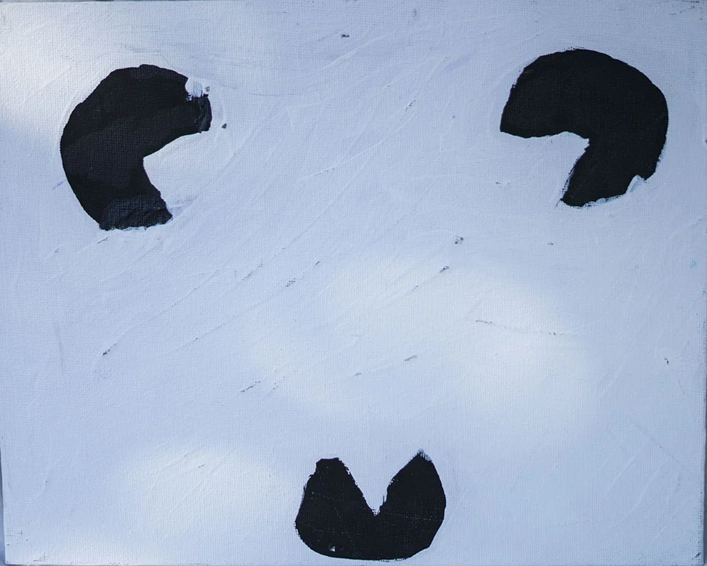 Minimalist painting of a smiley face with two black eye shapes and a black mouth on a white background.