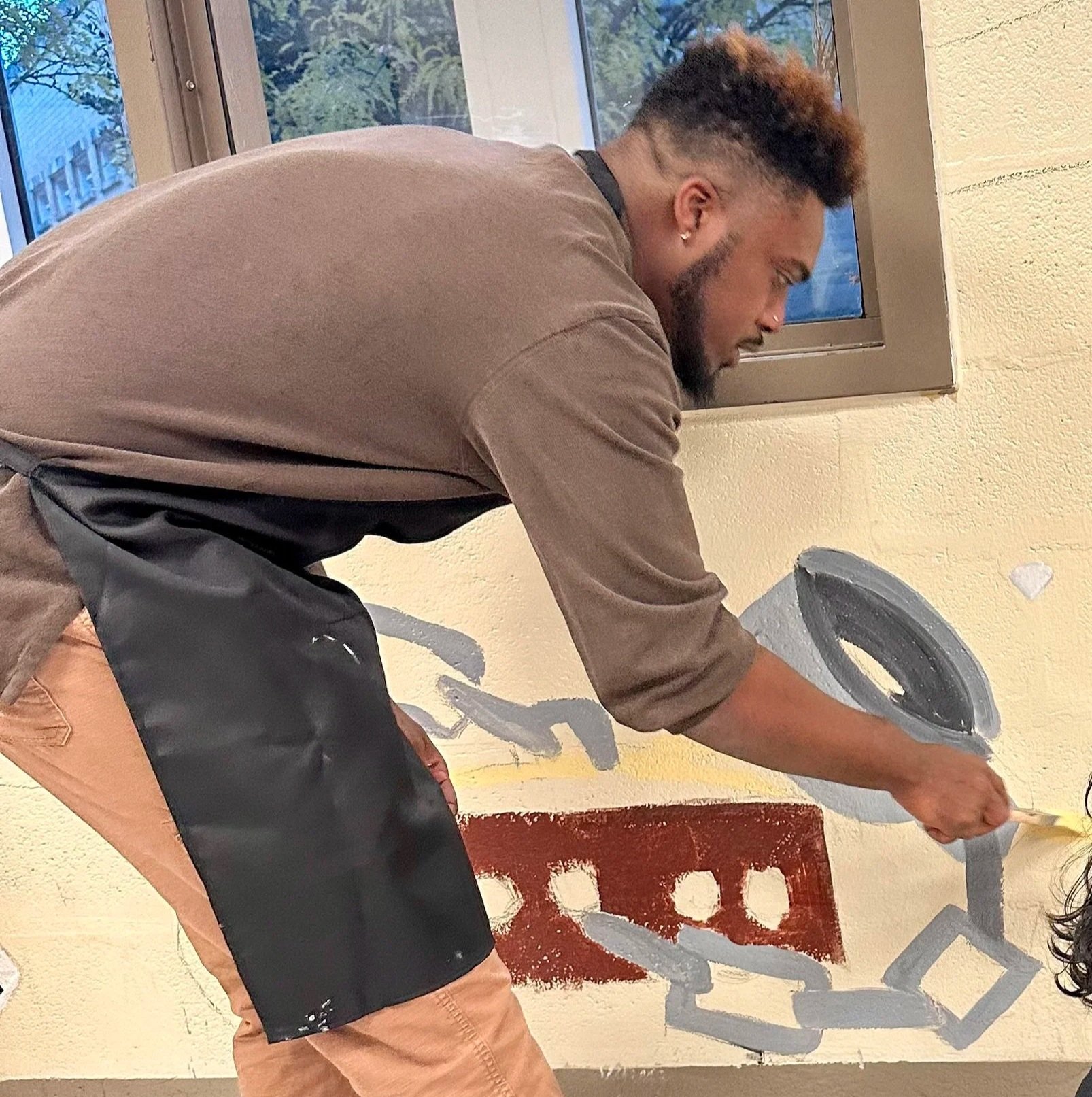 Lead Facilitator, Stan Pearson, painting with youth at the Baltimore City Juvenile Justice Center