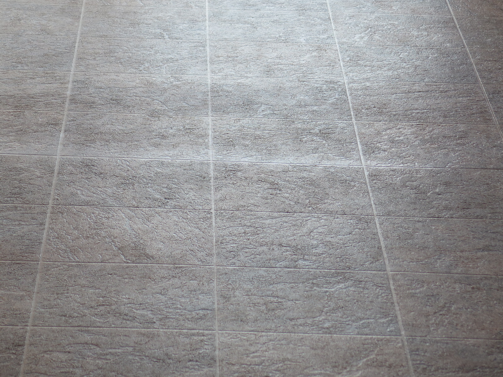 Sheen variation at sheet vinyl seam
