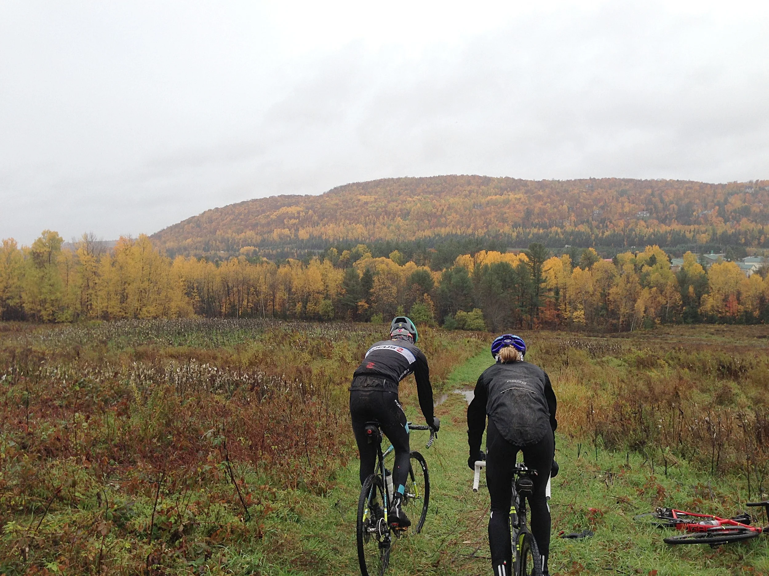 Maghalie rocking the Capo Lombardia rain jacket on a cold and rainy ride. Look at that butt flap!