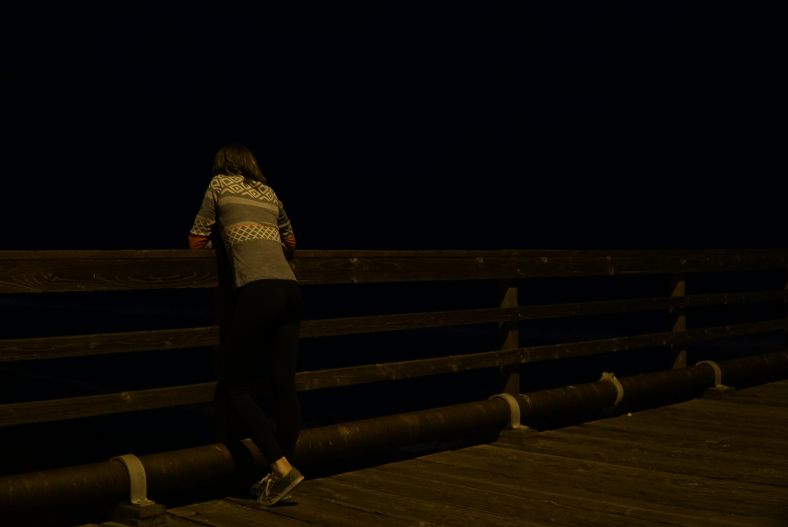 Haley wearing her Krimson Klover sweater on a chilly evening on the beach in California
