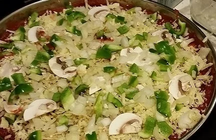 Once your crust is firm you can add sauce and toppings.