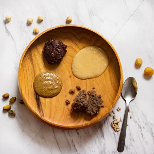 Clockwise from the top left: Hazelnut, macadamia, sunflower, Brazil + pistachio.