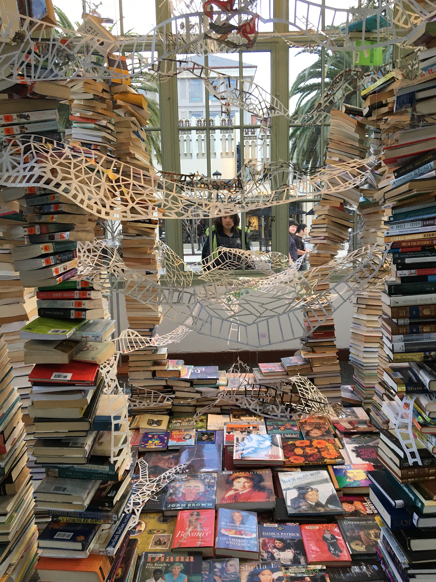 interior view with collection of books by and about women, loaned by Redwood City Library