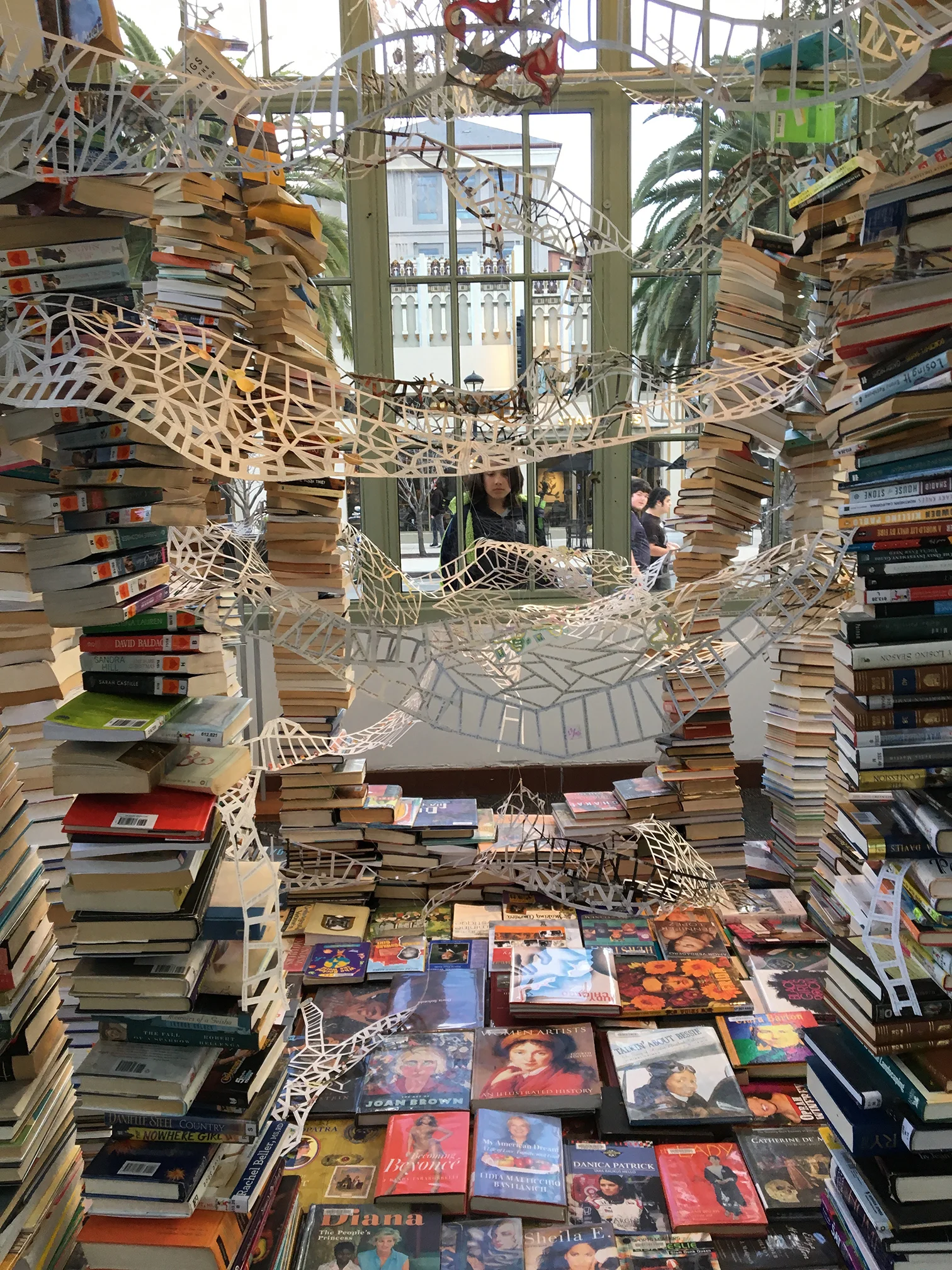 interior view with collection of books by and about women, loaned by Redwood City Library