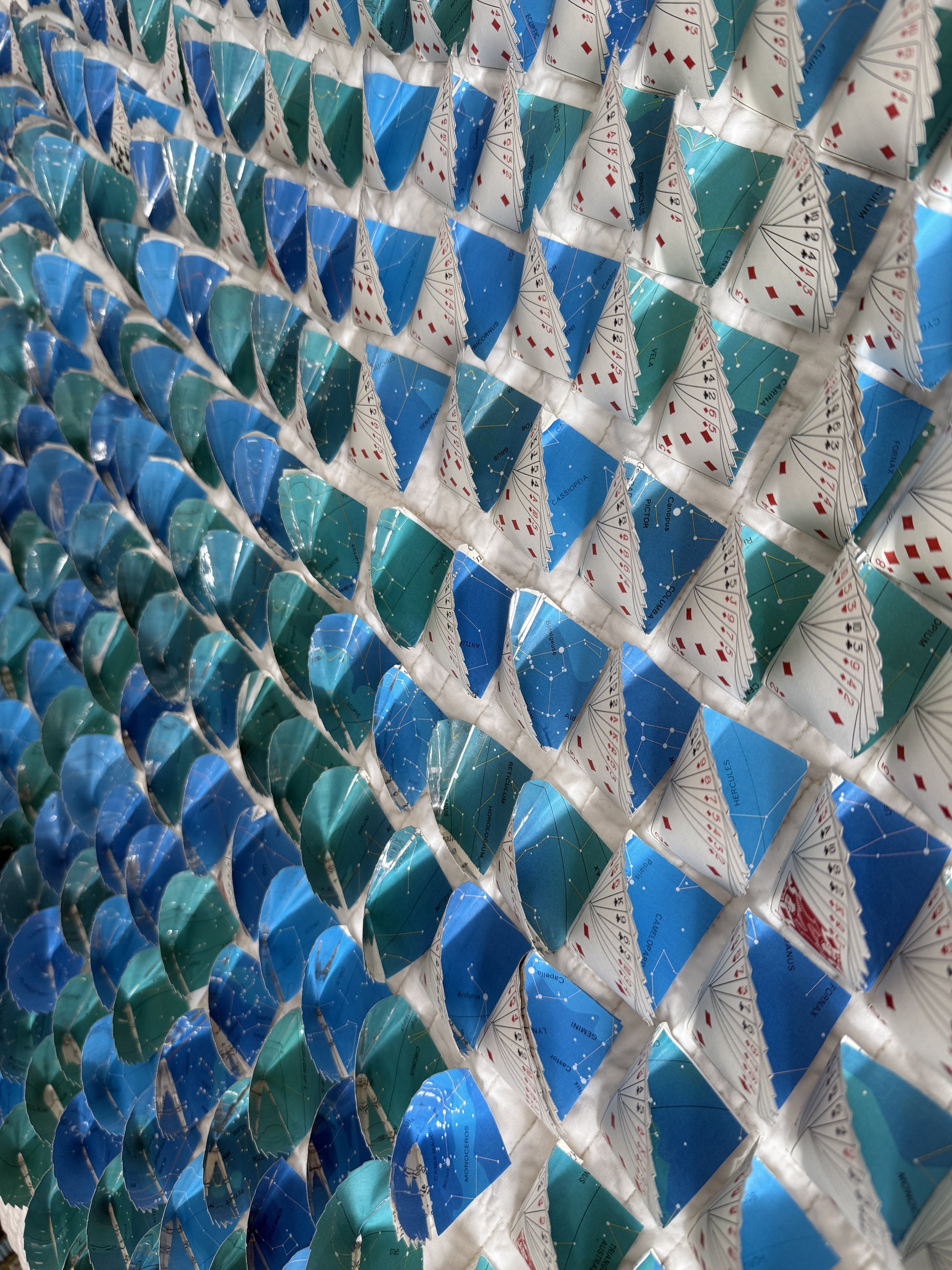 detail, bridge hands lined with constellations/lucky stars