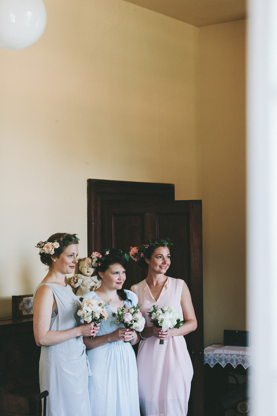  Bridesmaids with bouquets and floral crowns 