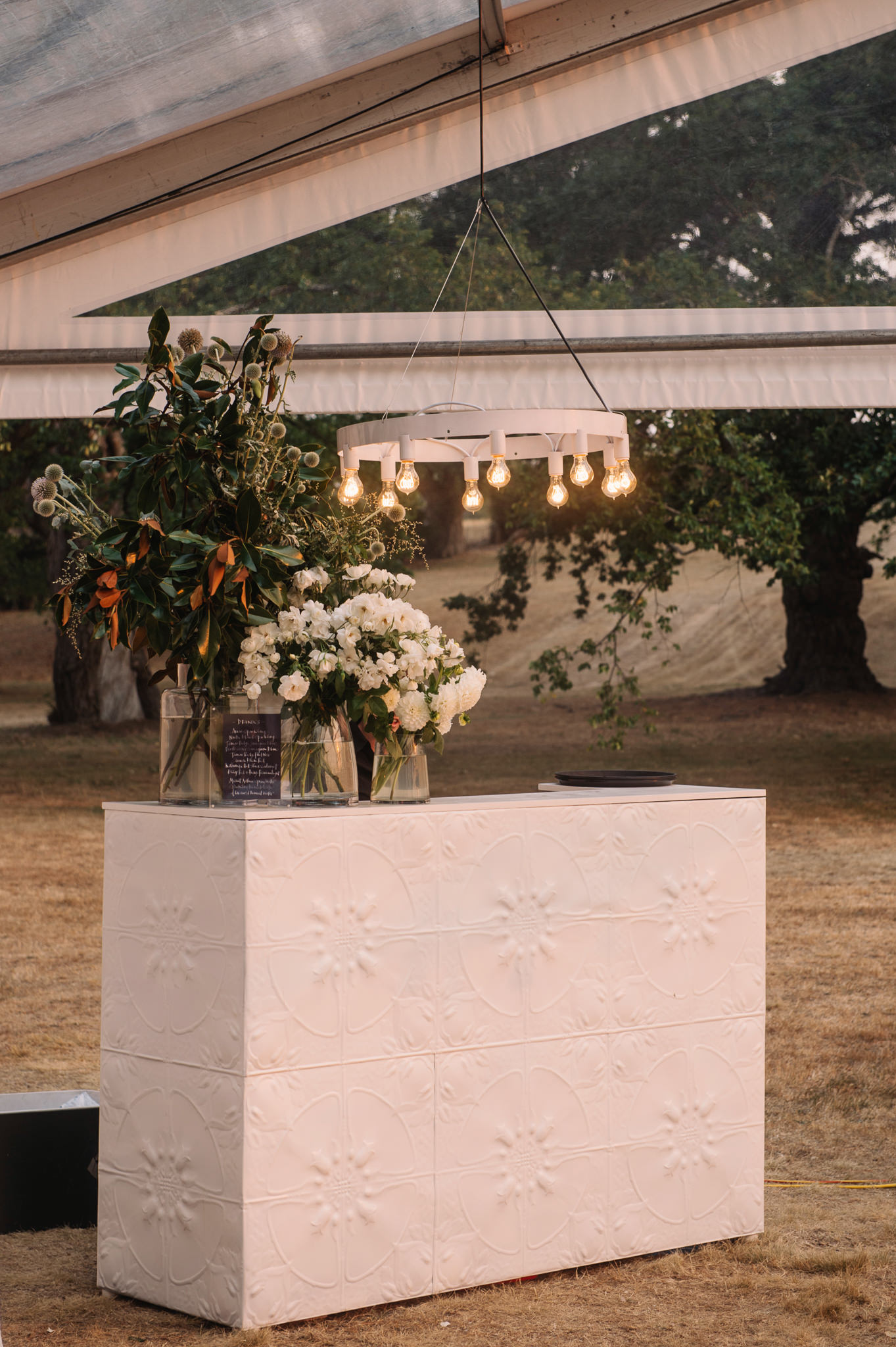  Pressed tin bar and custom lighting for the reception 