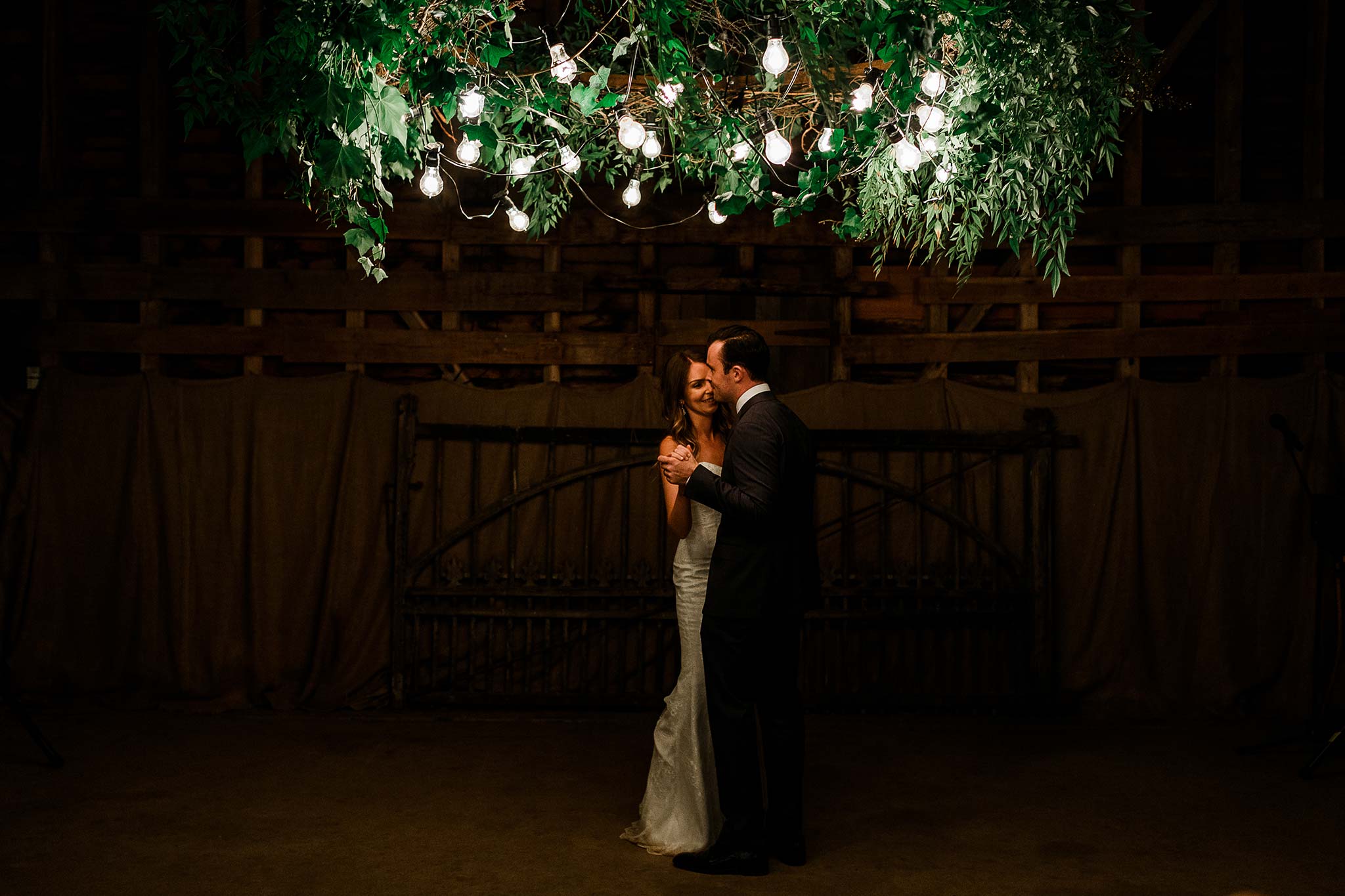  First dance under the custom made foliage chandelier 