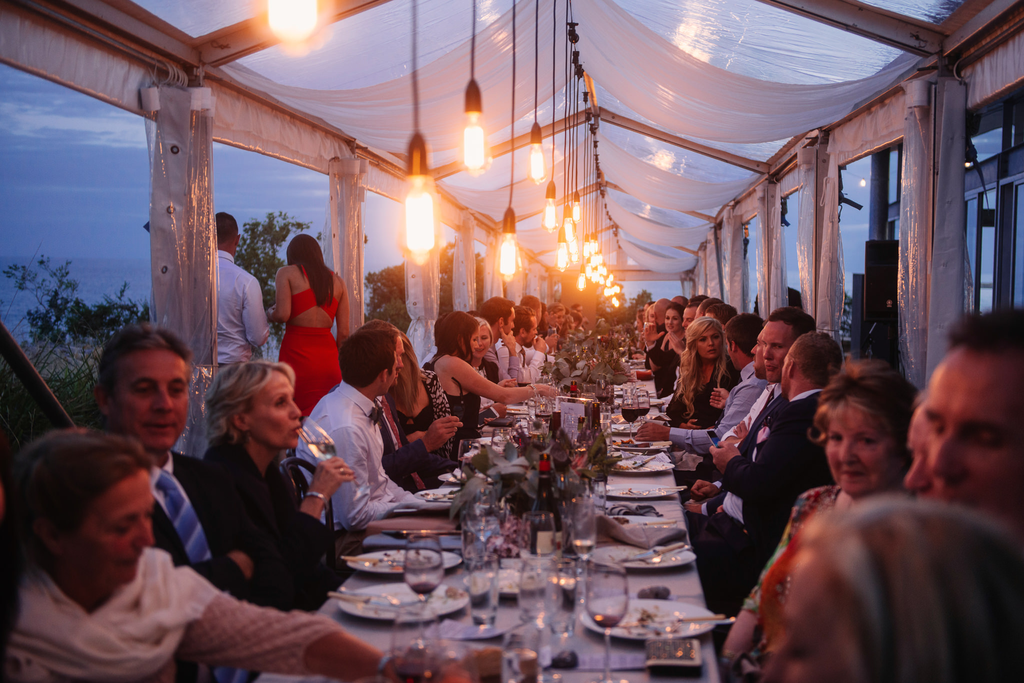  Long table in a clear marquee at Avalon Coastal Retreat 