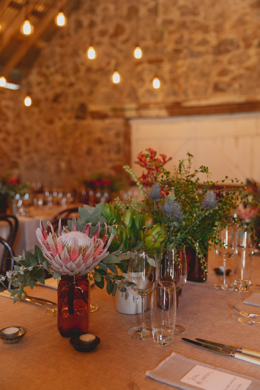  Native floral and vintage silverware on the tables 