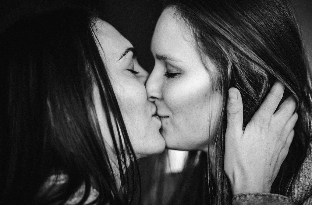 Same sex couple wedding kissing