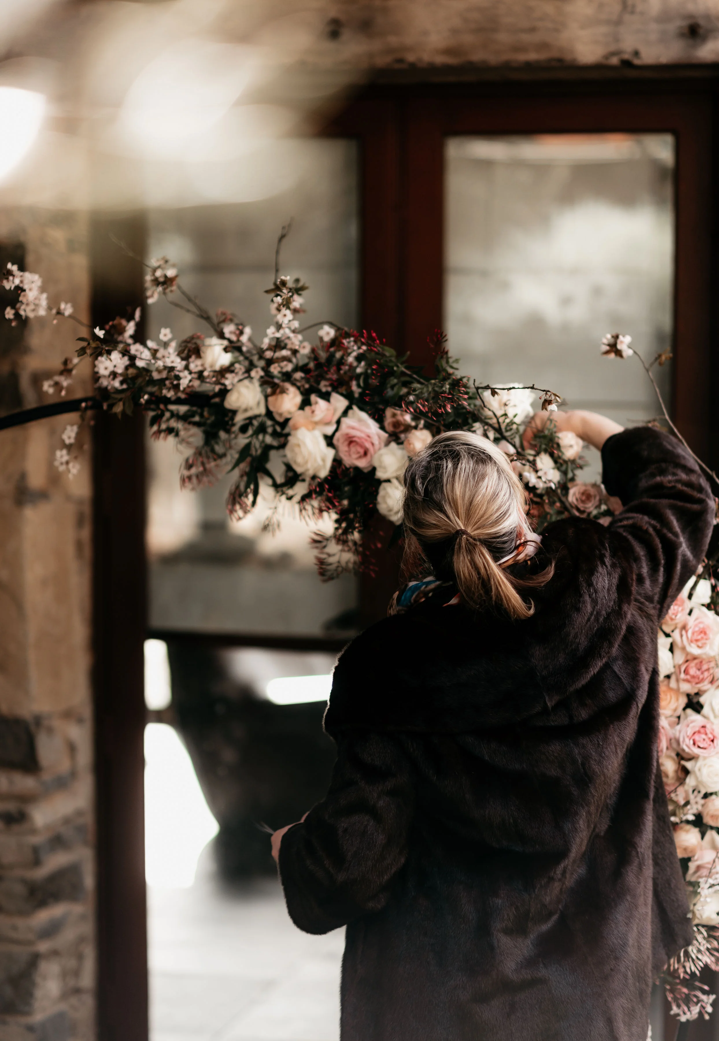 Bek at work on a floral arbor