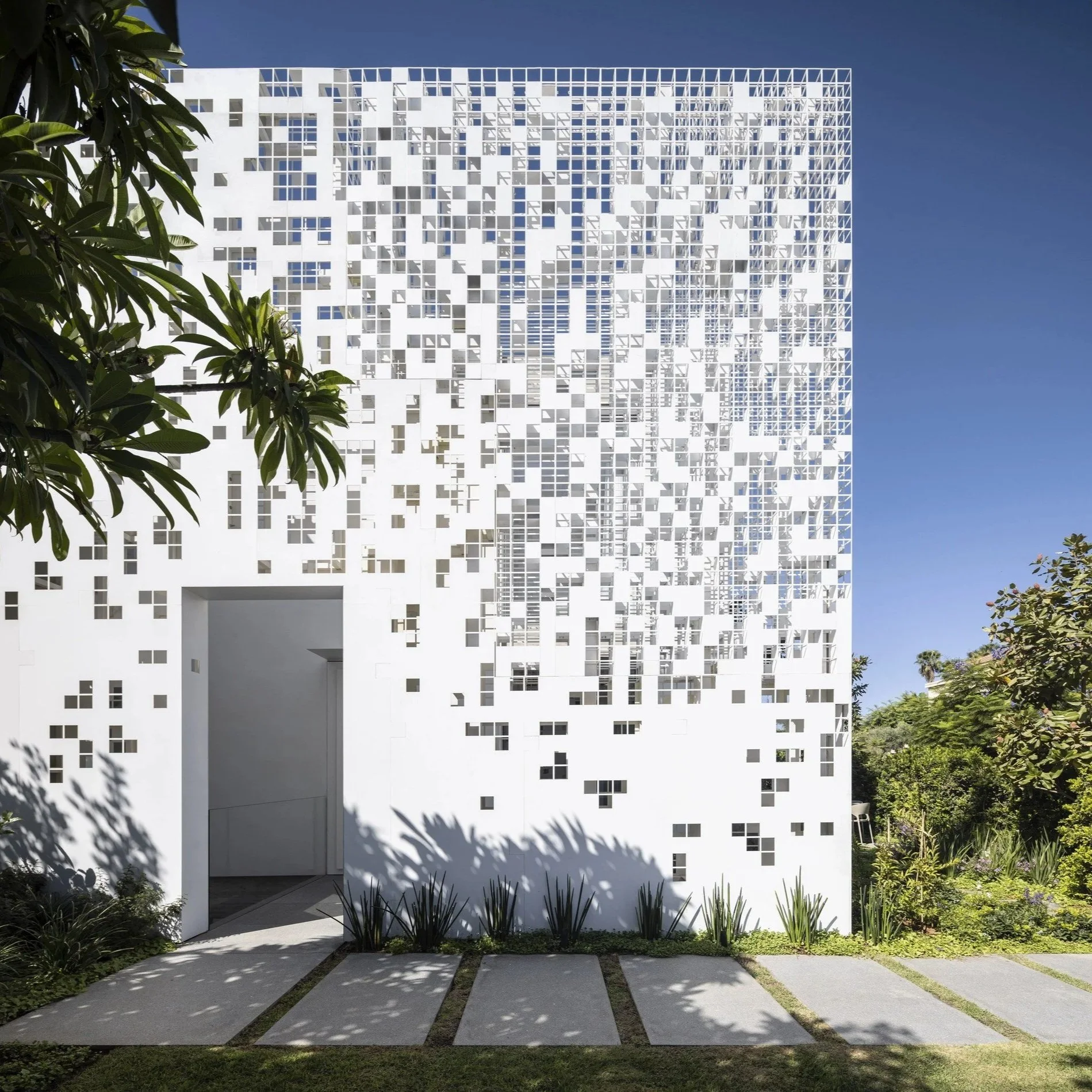 ArchDaily: Pixel House. An Anderman Architects residence in Tel Aviv, defined by a metal screen that gradually dissolves from a solid surface into the sky.