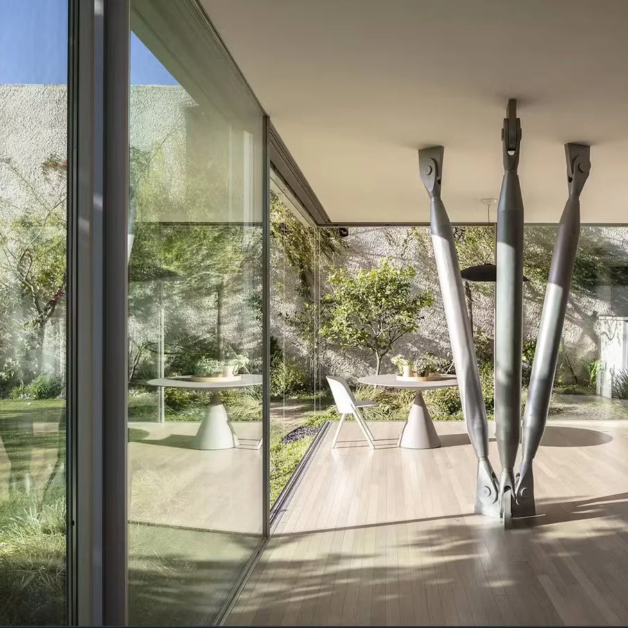 Dwell: Round Edge House. A feature on Anderman Architects’ Ramat Hasharon residence, its perforated façade, landscaped courtyards and indoor-outdoor connection.