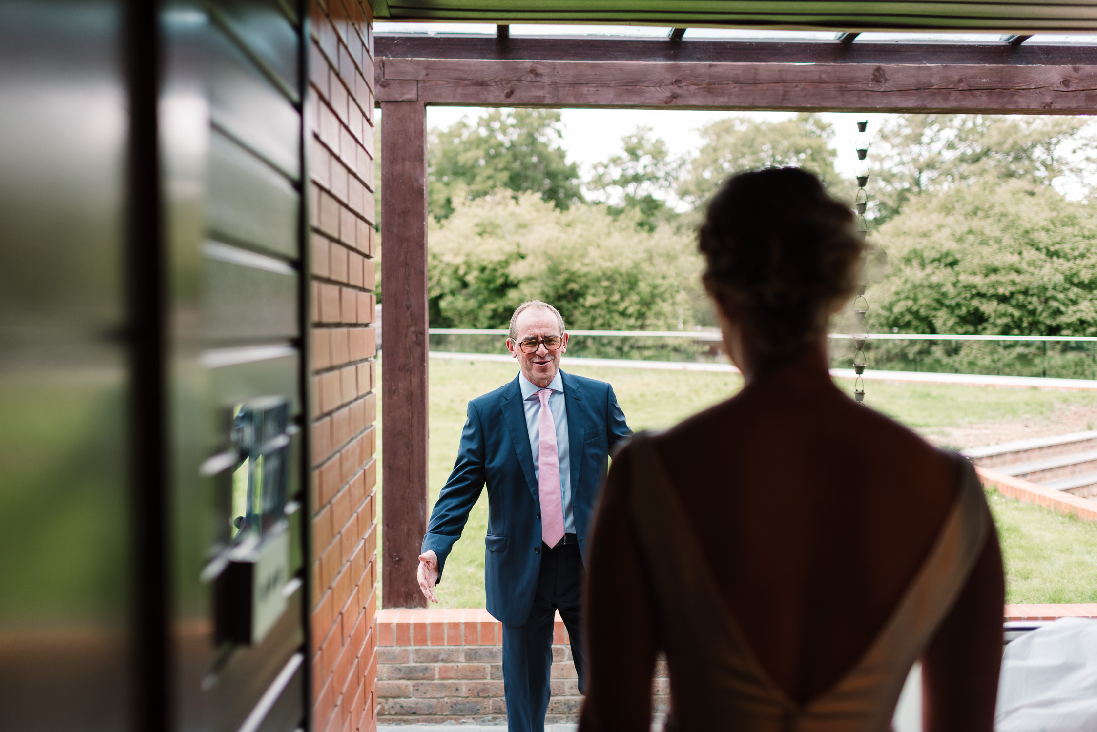 bride's father seeing his daughter in her wedding dress