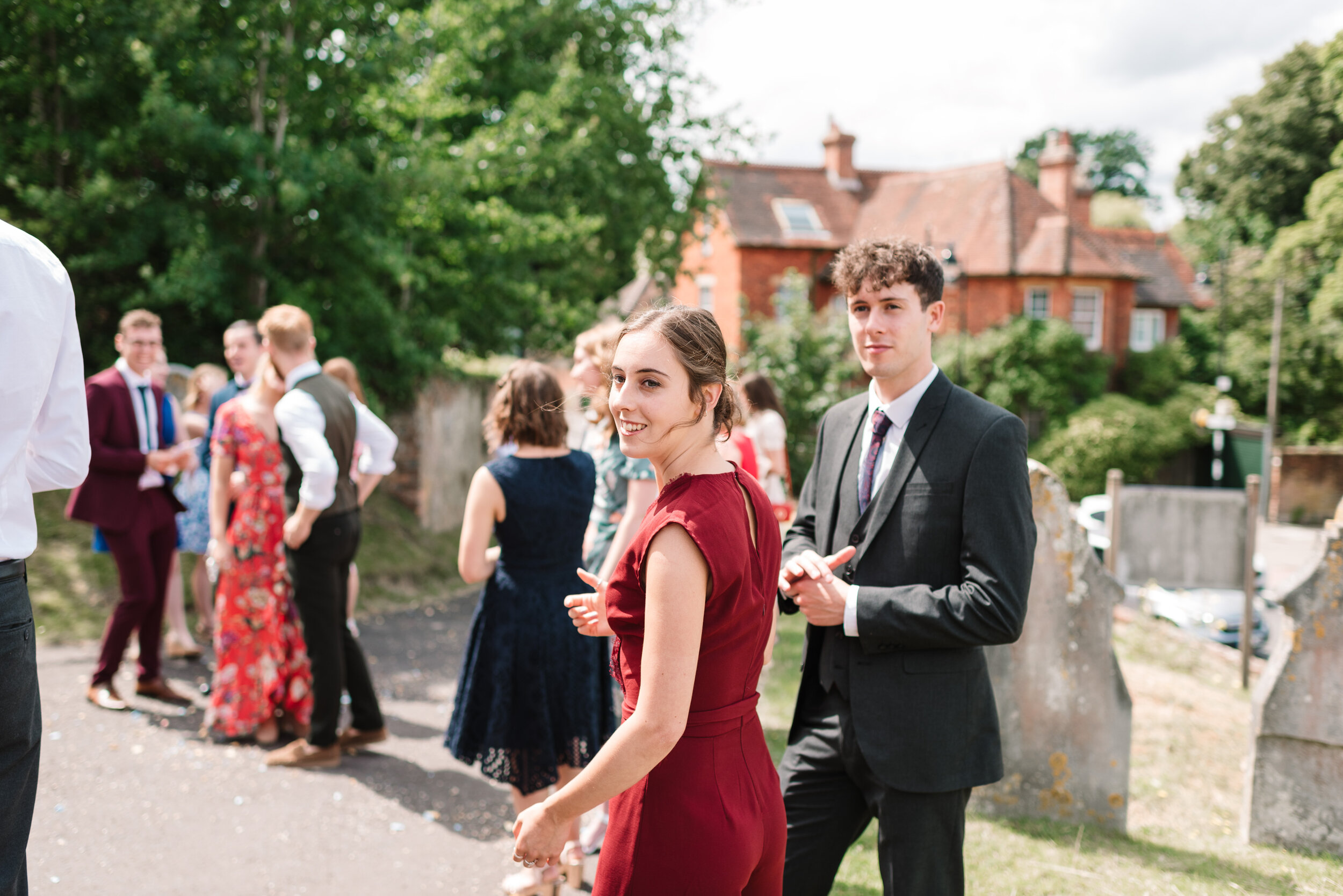Wedding guests walking away from church 