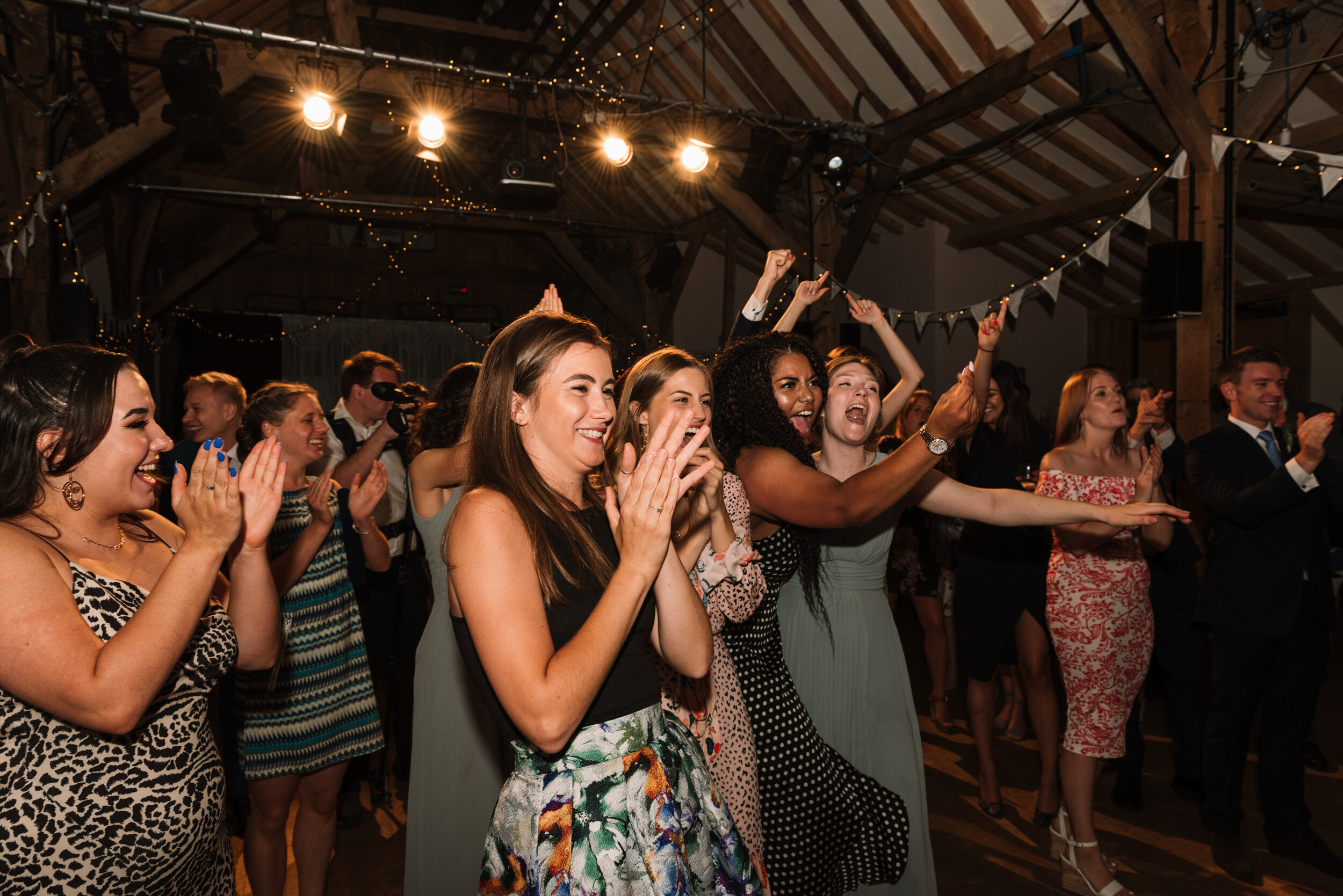 Guests cheering for band at Hanger Farm wedding