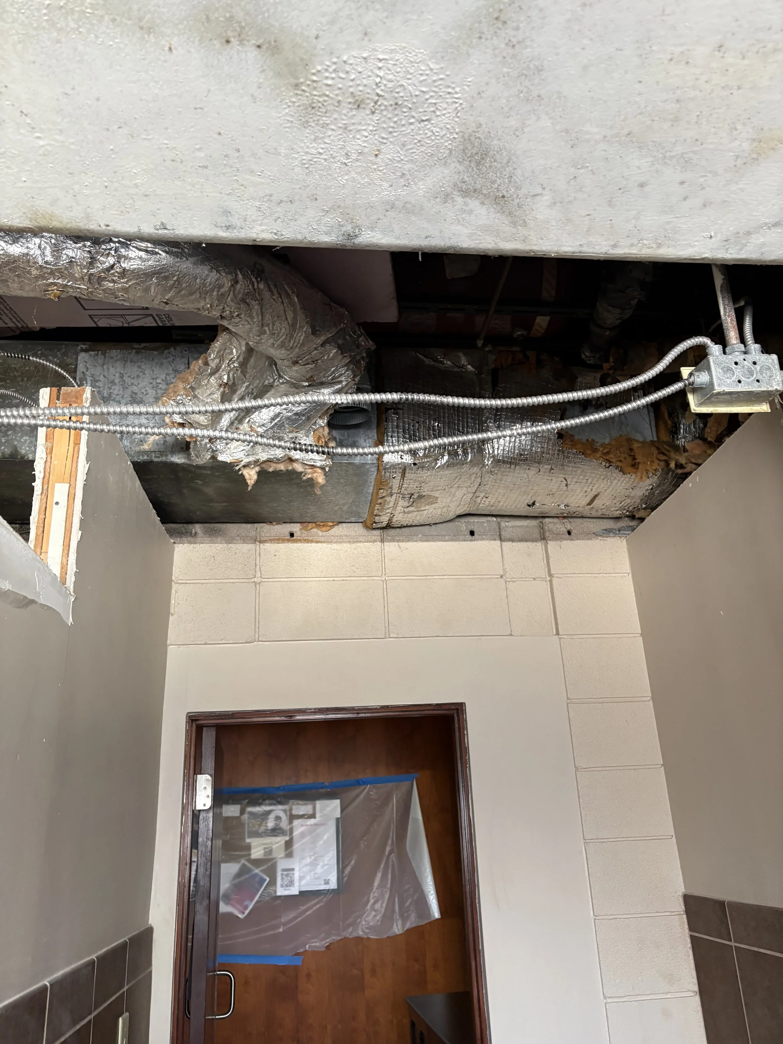 Old HVAC equipment removed from bathroom ceilings