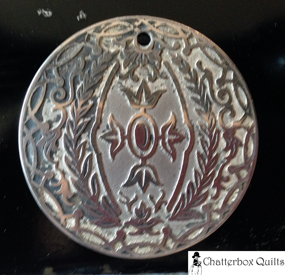 One of the chrome pieces partially cleaner - note the unclean, dark areas.
