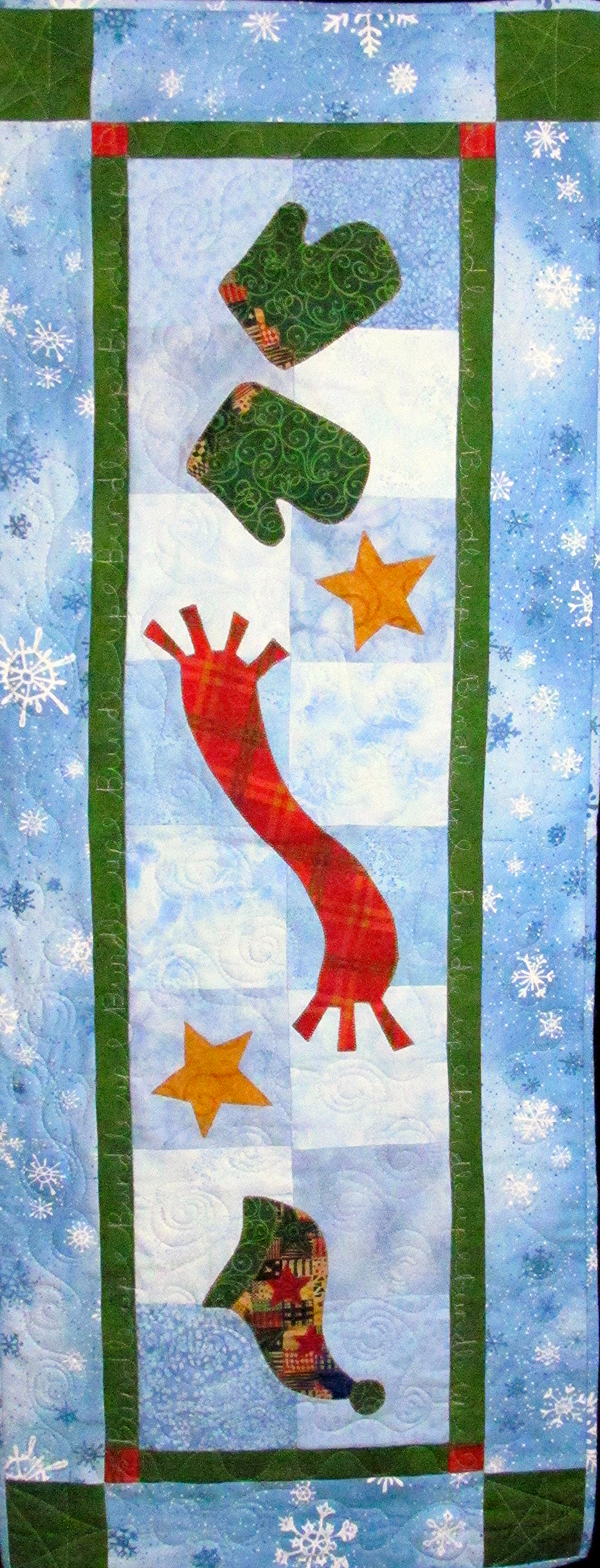 Bundle Up by Chatterbox Quilts can be either a table runner or a wall hanging.
