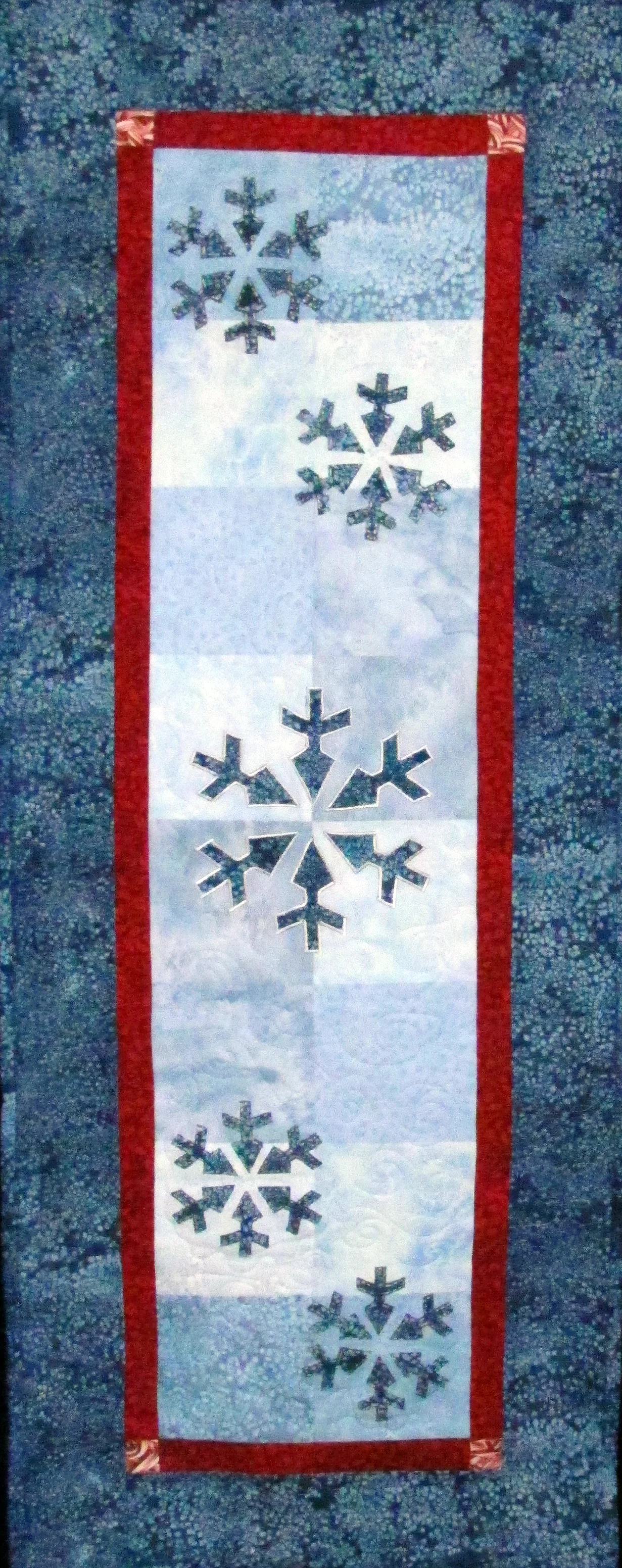 Snowflakes a' Fallin' by Chatterbox Quilts makes a lovely table runner.