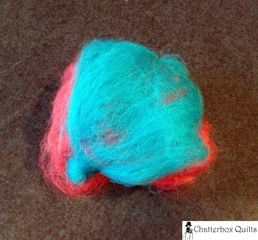 Layers of wool roving ready for felting