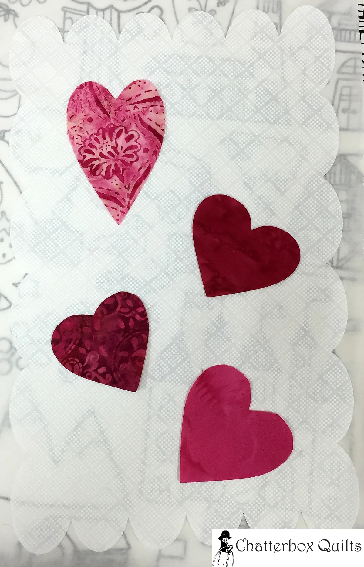 Hearts fused to the scalloped appliqué background