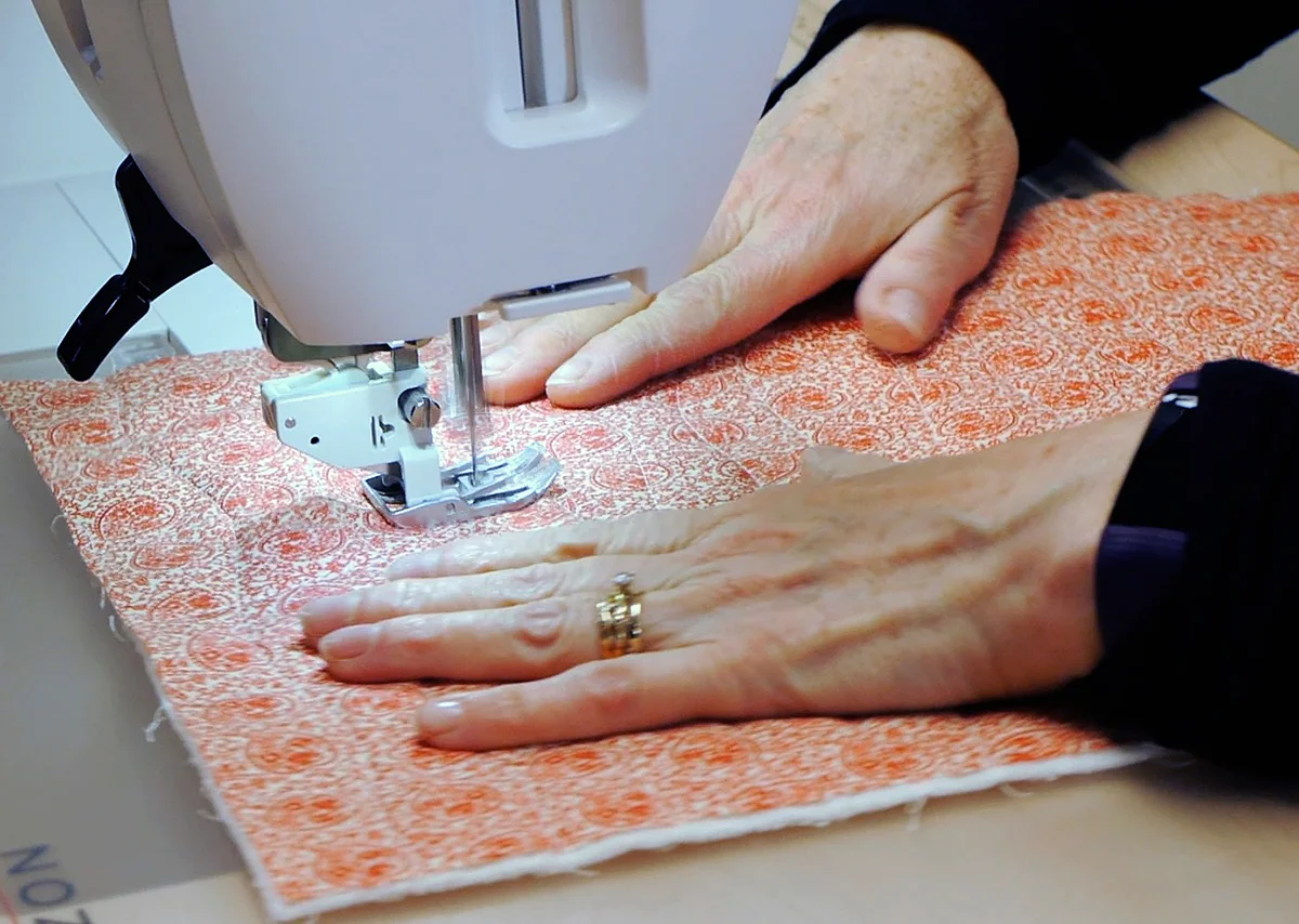 Quilting the top and batting with the Janome Horizon Memory Craft 9400 QCP's amazing walking foot with AcuFeed Flex system
