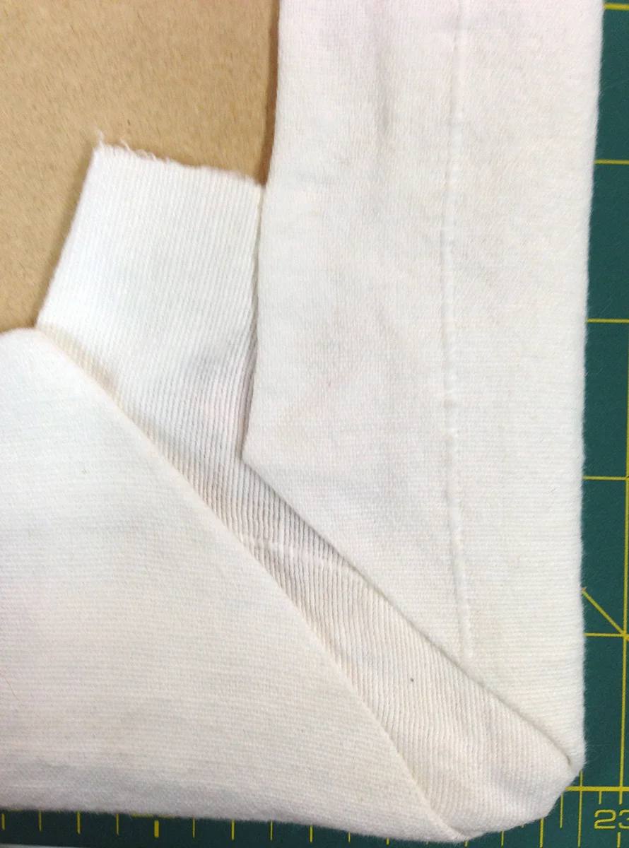 You probably won't get a perfectly mitered corner, but at least it will look neat