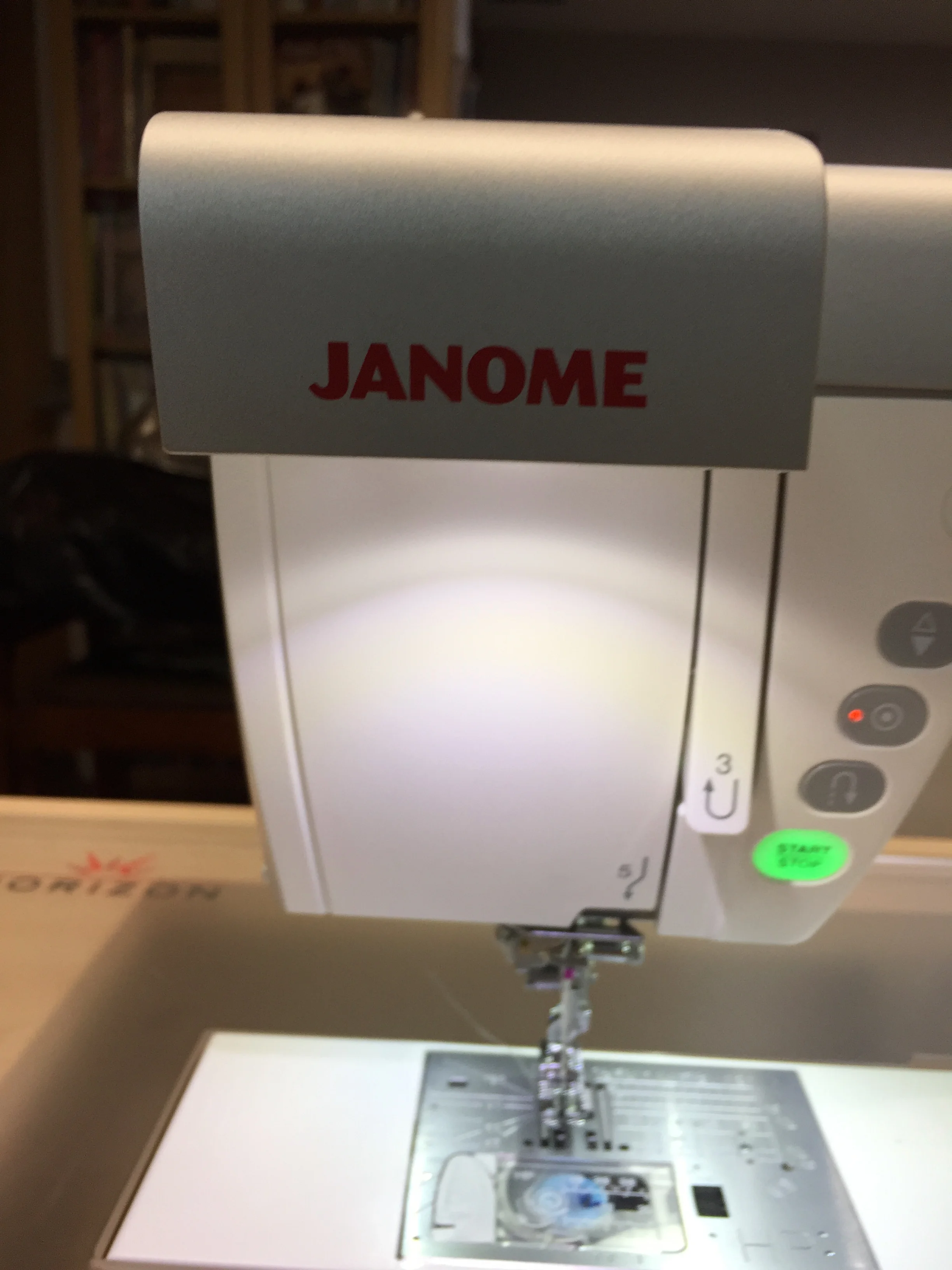 It's behind the Janome name! Just pull out and angle it for the best light on your project.