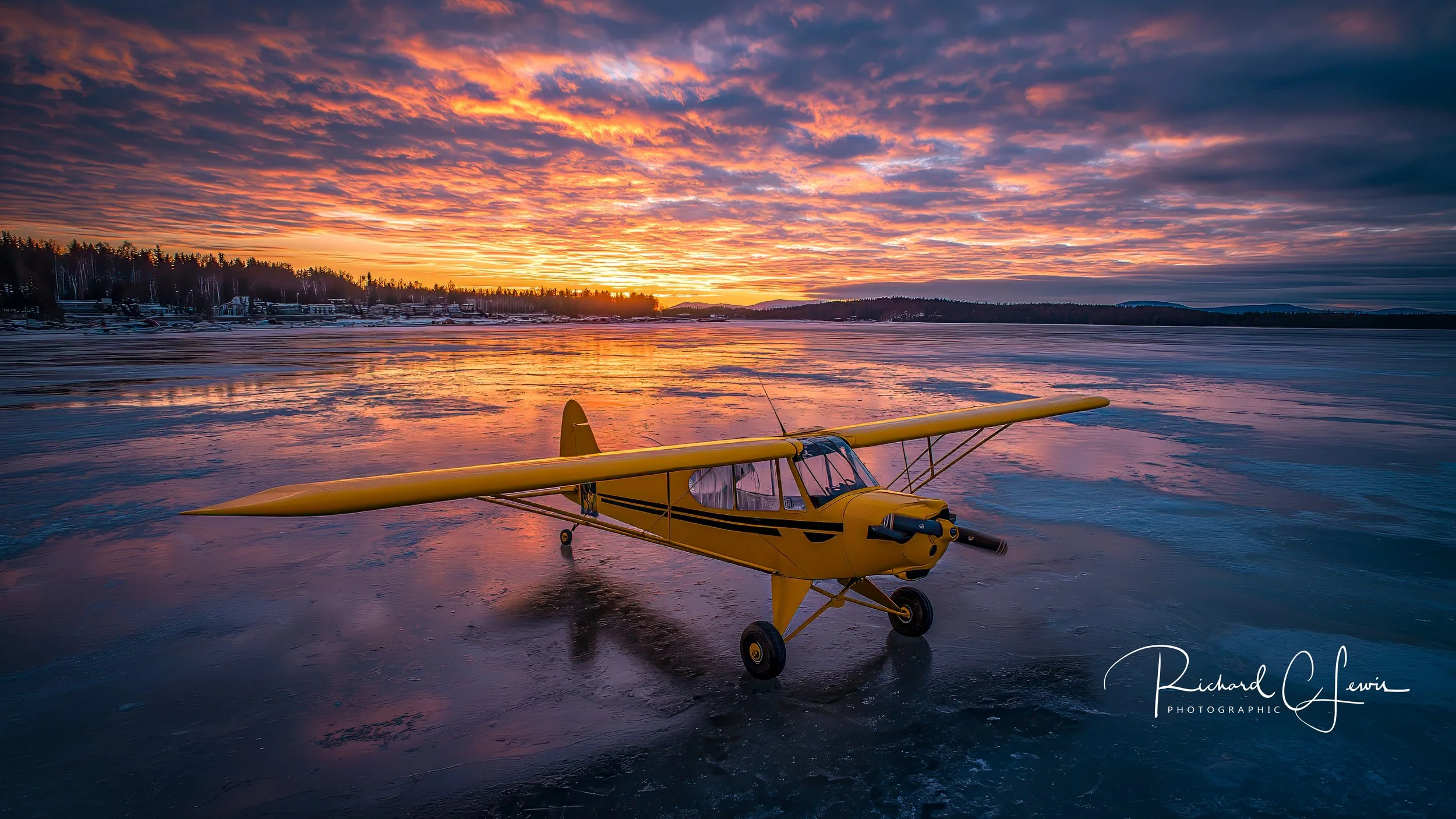20260215-lewisr406_a_1945_Yellow_Piper_Cub_is_parked_on_the_frozen_lake__629e0146-756f-4c5f-9b3b-a755f90e1368-Edit.jpg (Copy)