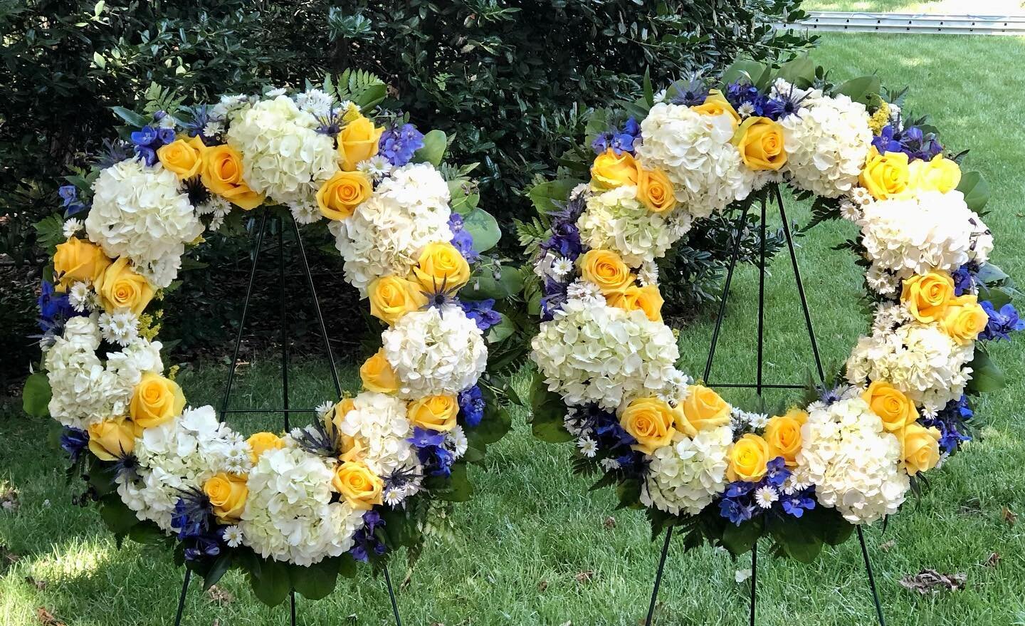 We are so proud of this beautiful feminine pair of tribute wreaths for the quintessential Navy wife, mother and friend. It is always an honor to provide sympathy flowers for Navy and Marine Corps members and their families.